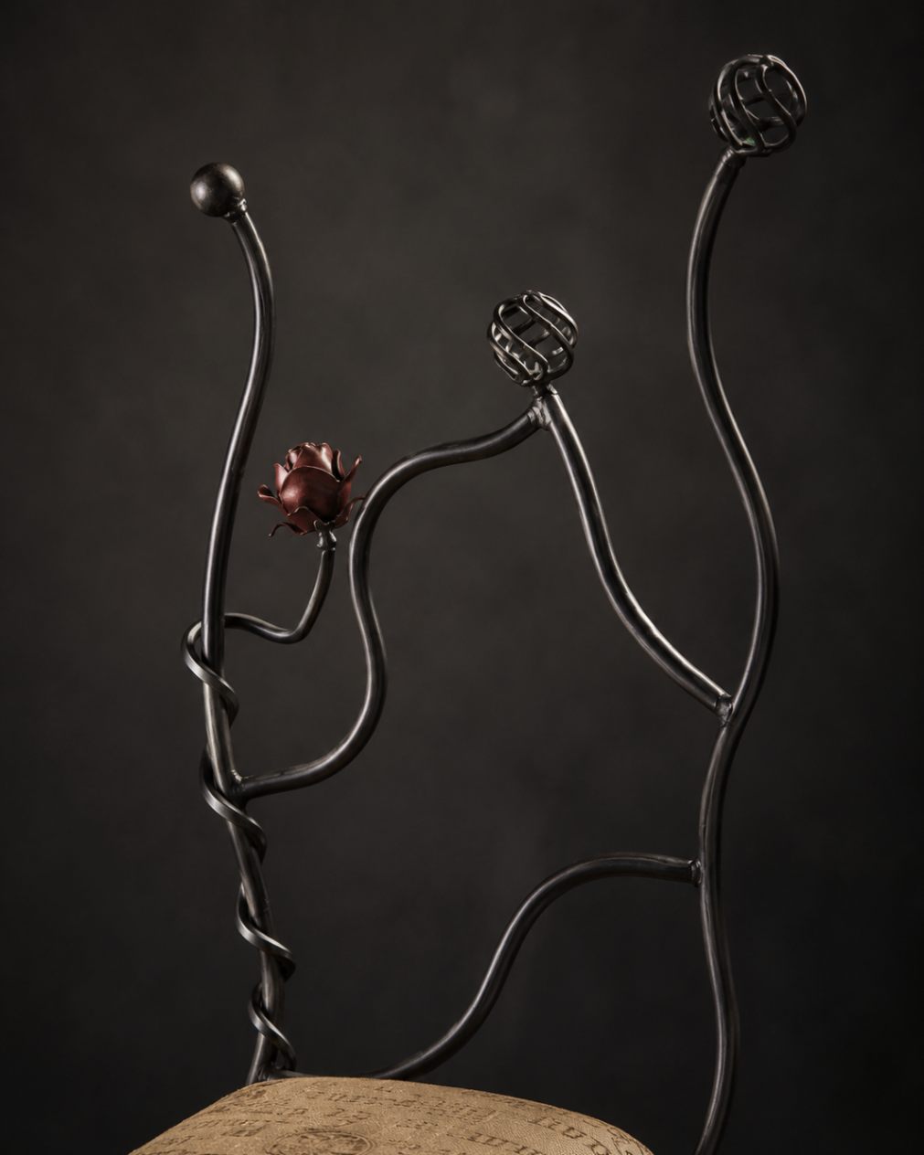 Close detail of the Rose Chair back, showing twisted stems and a copper rose